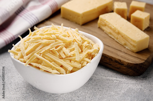 Heap of grated delicious cheese. Concept: Italian cuisine, cheese, restaurant, and food.