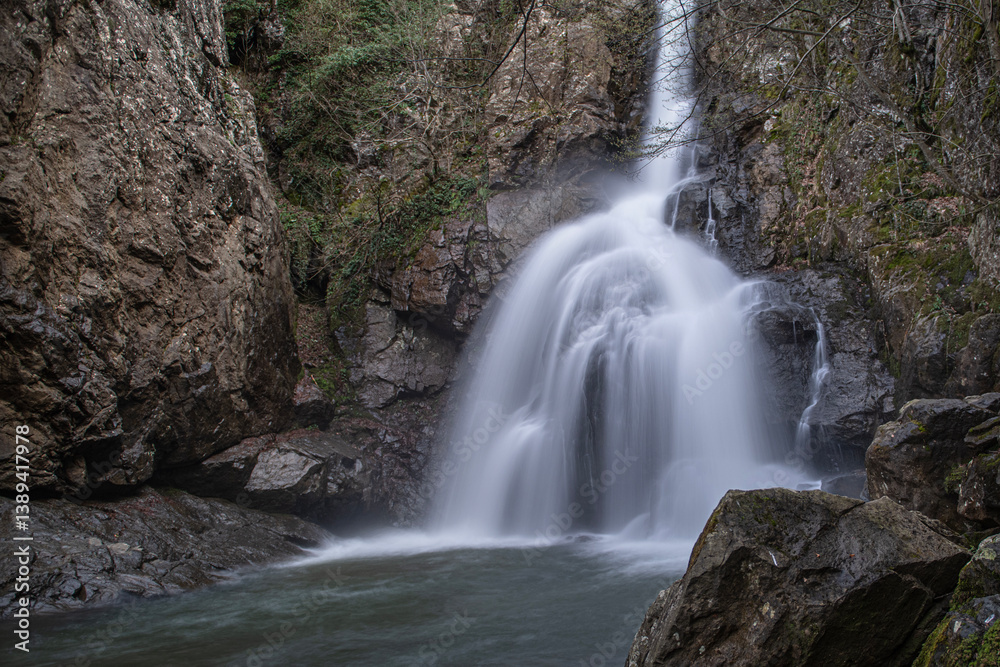 Obraz premium Erikli Waterfall photograph taken with long exposure. Waterfalls in Turkey. Waterfall view in the forest. Erikli Waterfall, Yalova.