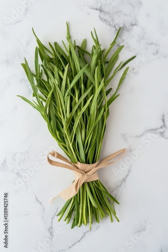Overhead shot of bundled tarragon labeled and isolated, minimalist flat-lay herbal series