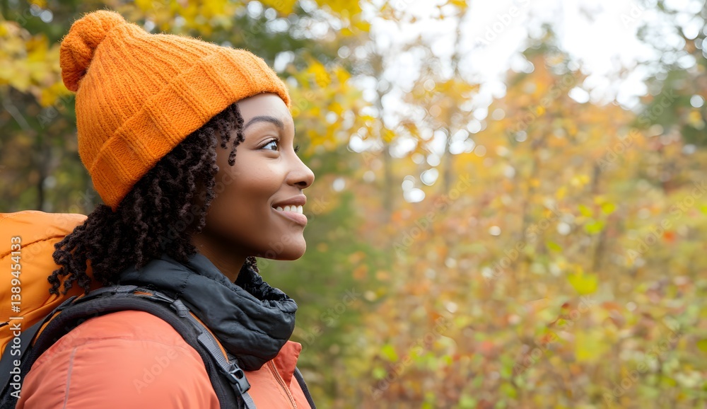 Woman wearing orange hat and jacket outdoors in autumn forest looking away. Woman wearing orange hat and jacket outdoors in autumn forest looking away.