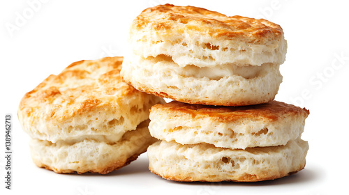 Flaky golden biscuits stacked on white background, showcasing their buttery layers and soft texture, perfect for breakfast or snacks