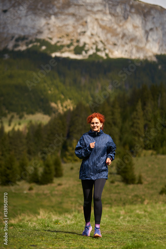 Obraz na płótnie Woman trail running in the mountains......... w salonie