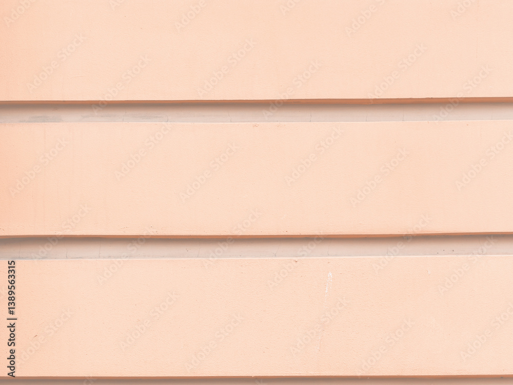 Decorative elements on the wall. Rough painted surface. Empty place for text, images and ads. Vintage texture for background and design. Closeup.
