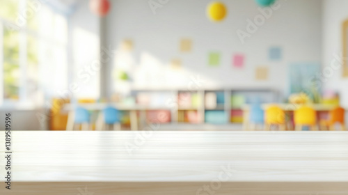 Empty wooden table with blurred background of a modern classroom with colorful decor