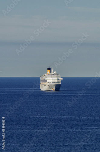 Obraz na płótnie Mega family cruiseship cruise ship liner Fortuna anchored offshore of Civitavecchia Rome, Italy before reactived after Covid pandemic with other vessels in port and coastline w salonie