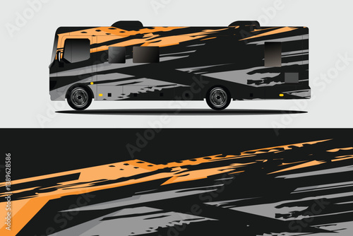 Modern RV with dynamic orange and gray design parked on a neutral background, showcasing sleek lines