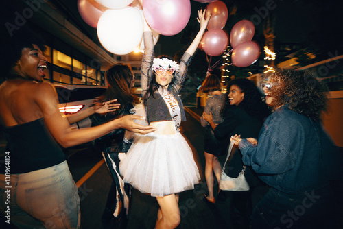 Group of young women celebrating a bachelorette party during a fun night out