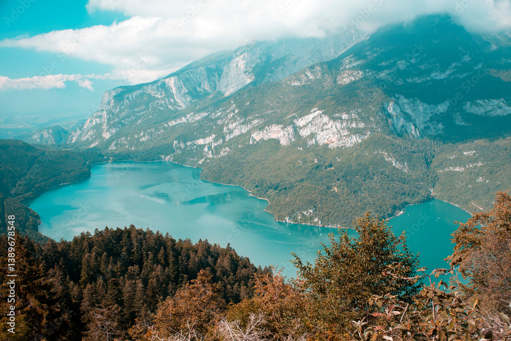 Obraz premium Aerial View of Lake Molveno – Alpine Lake Surrounded by Forest and Mountains in Trentino, Italy