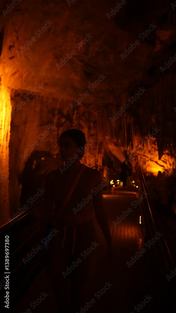 Embarking on an adventure to explore a stunning and fascinating cavern with warm lighting Embarking on an adventure to explore a stunning and fascinating cavern with warm lighting
