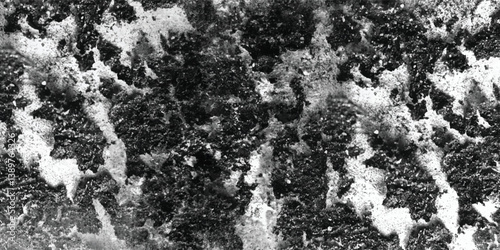 A monochromatic study emphasizing the sculptural quality of a surface defined by its numerous raised and recessed elements.
