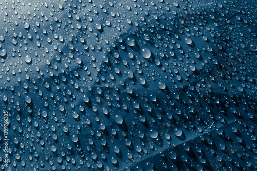 Water drops on blue surface, texture background