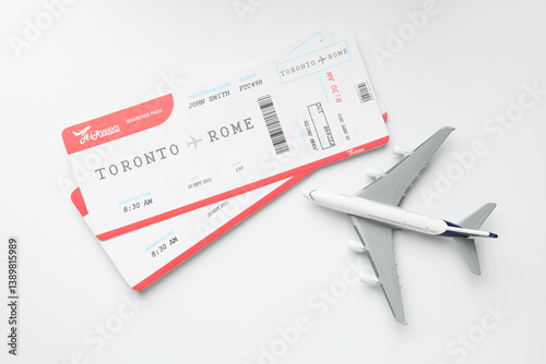 Obraz na płótnie Travel agency. Flight tickets and plane model on light background, flat lay w salonie
