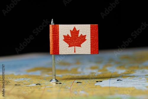 Canada map with a pin showing the national flag. Close-up view. Travel, geography, and politics concept.