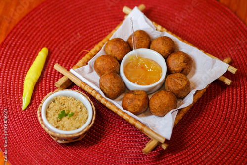Delicious fried codfish balls with tasty side dishes, Manaus, Amazonas, Brazil.