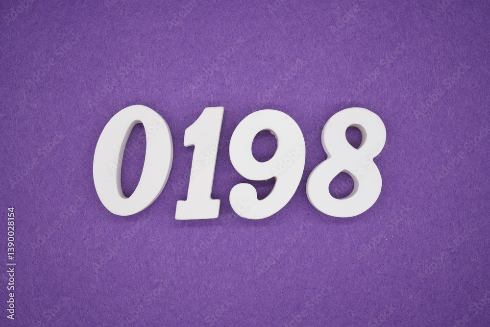The numbers are made of white painted wood placed on a purple paper background. The numbers are made of white painted wood placed on a purple paper background.
