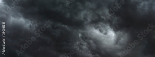 Banner Dramatic dark storm clouds black sky background. Dark thunderstorm clouds rainny season. Panorama Meteorology danger windstorm disasters climate. Dark cloudscape storm cloud with copy space.