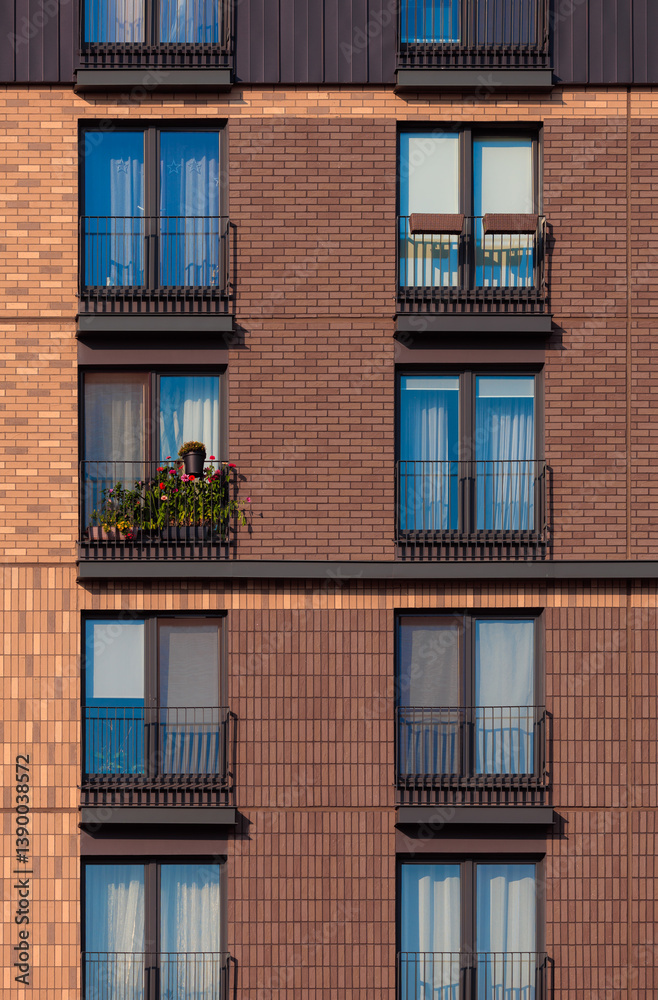 Fototapeta premium Modern buildings, walls and windows. City view on a sunny day. 