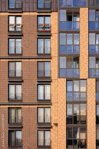 City view on a sunny day. Modern buildings, walls and windows. 