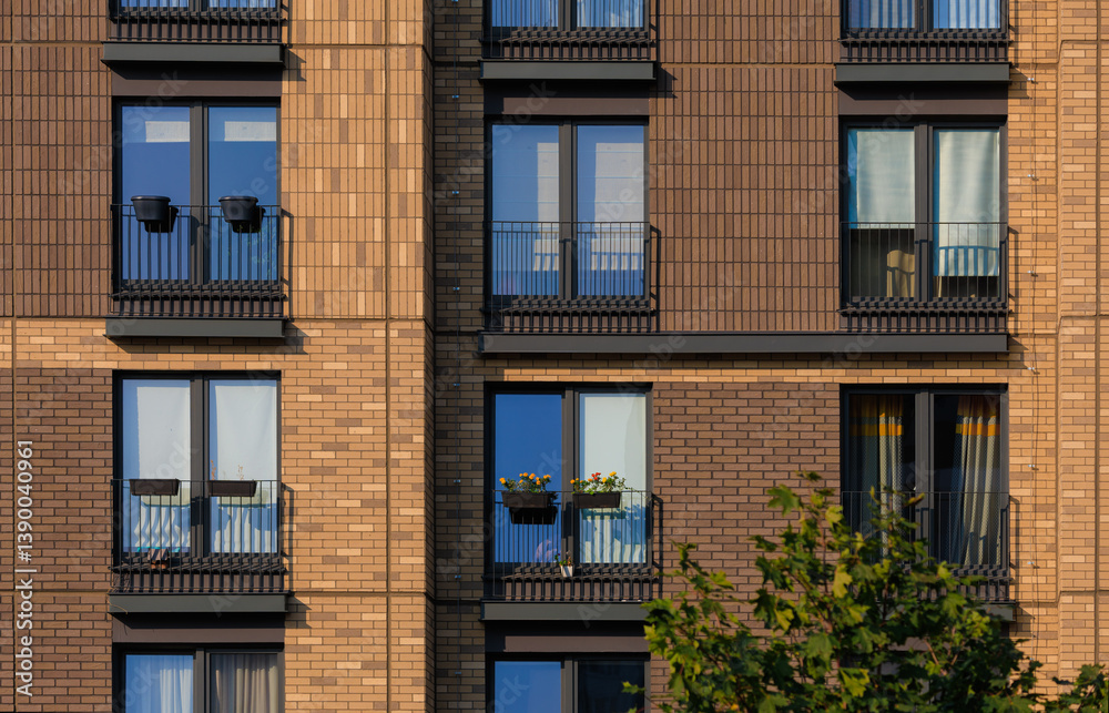 Fototapeta premium City view on a sunny day. Modern buildings, walls and windows. 