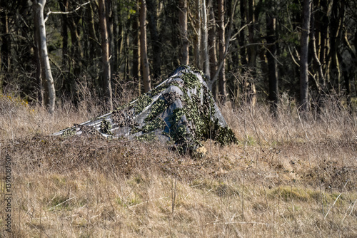 Obraz na płótnie army camouflage netting cover deployed to hide broadcast equipment w salonie