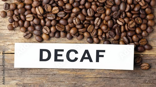 4k video of coffee beans with Decaf label.