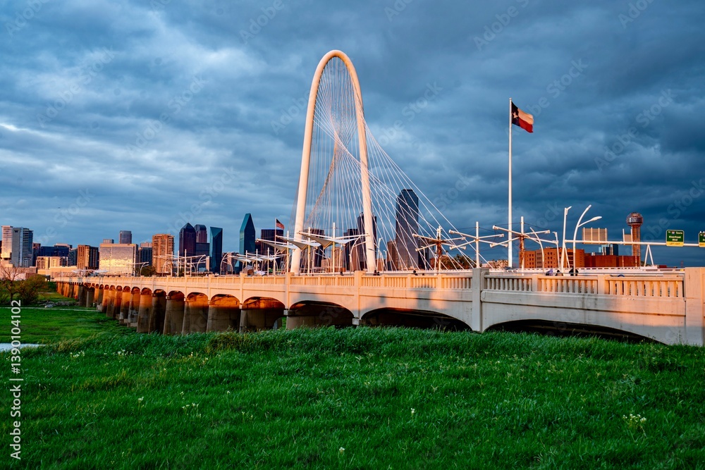 Downtown Dallas, TX behind the Margaret Hunt Bridge at Dusk