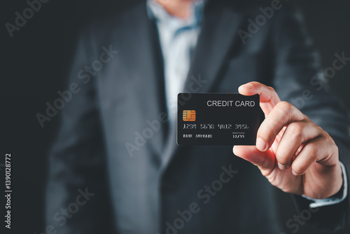 businessman hold credit card and use smartphone to buy or purchase produce payment online. The concept of finance and online shopping.