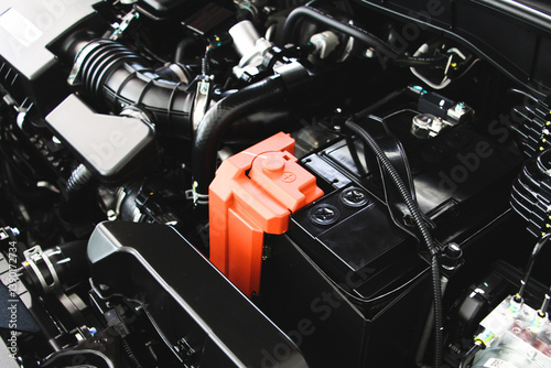 Close up car battery with car engine. Maintenance car repair automotive concept. Transportations concept.