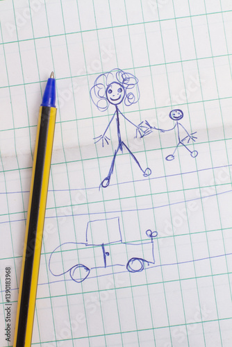 Doodles of a mother and son and a car and pen on graph paper in a top view