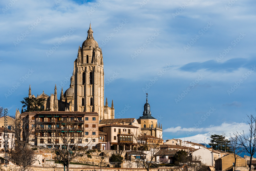 Panoramic view of Segovia impressive cathedral against the Guadarrama mountain range. Panoramic view of Segovia impressive cathedral against the Guadarrama mountain range.