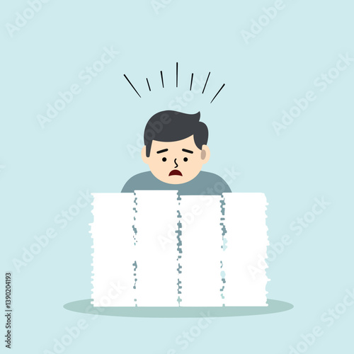 worried man sits behind a large stack of papers suggesting stress and a heavy workload.