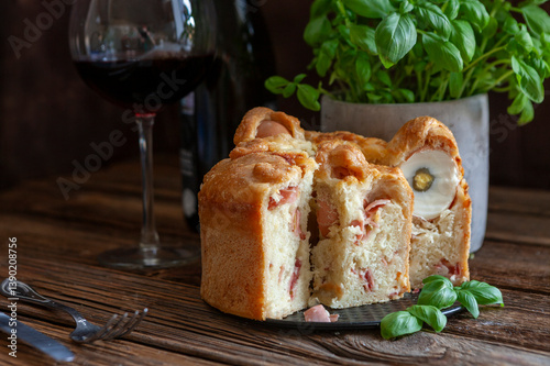 Casatiello napoletano - Italian stuffed festive homemade Easter savory bread with salami, cheese and eggs