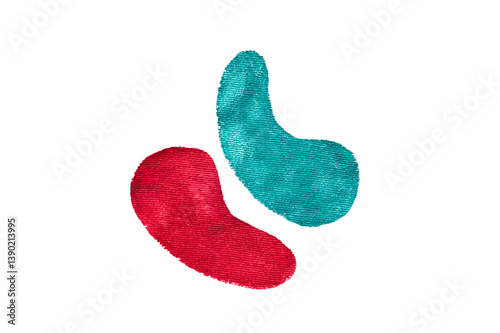 Two embroidered fabric shapes in red and turquoise on transparent background. Abstract textile art elements