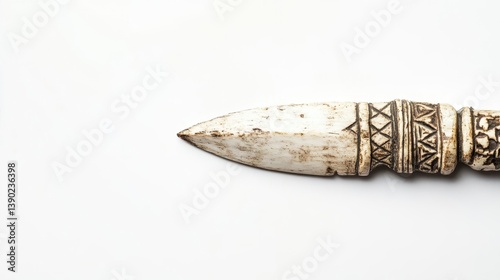 Detailed image of an antique carved ivory spearhead weapon