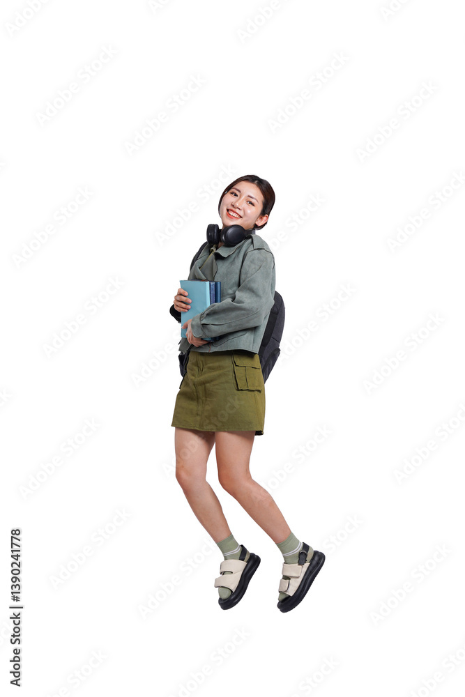 Portrait of Asian female student wearing backpack, headphones, fashionable clothes, posing dynamically on white background
Portrait of Asian female student wearing backpack, headphones, fashionable clothes, posing dynamically on white background