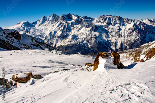 Breathtaking panorama of the 4000 metre mountains of the canton of Valais photographed on the snowshoe tour through the Trift Glacier. The photo shows the Allalinhorn, Alphubel, the Täschhorn, the Dom