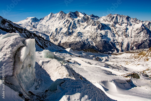 Breathtaking panorama of the 4000 metre mountains of the canton of Valais photographed on the snowshoe tour through the Trift Glacier. The photo shows the Allalinhorn, Alphubel, the Täschhorn, the Dom