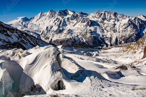 Breathtaking panorama of the 4000 metre mountains of the canton of Valais photographed on the snowshoe tour through the Trift Glacier. The photo shows the Allalinhorn, Alphubel, the Täschhorn, the Dom