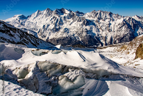 Breathtaking panorama of the 4000 metre mountains of the canton of Valais photographed on the snowshoe tour through the Trift Glacier. The photo shows the Allalinhorn, Alphubel, the Täschhorn, the Dom photo