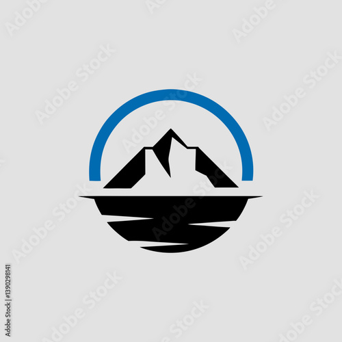 Mountain peak reflected in water with blue arc above it