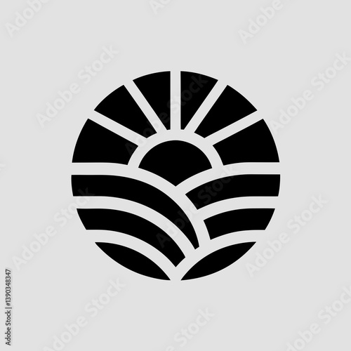 Stylized sun rising over fields in a circular emblem design