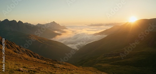 capture the beauty of a tranquil sunrise over misty mountains , where soft , golden sun light gently lights of the vellys below.this image portrays the clamness of nature and the briathta.hd