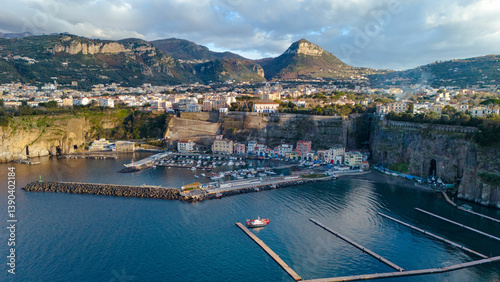 Aerial sunset view of Piano di Sorrento, a coastal town on the Sorrento Coast in southern Italy, showcasing urban landscape and Mediterranean scenery.