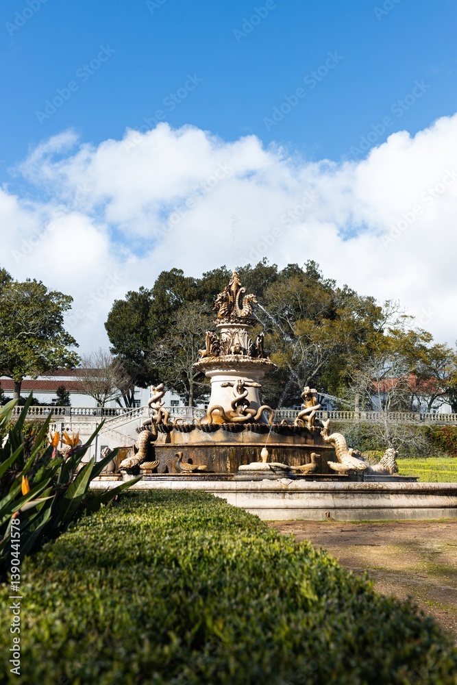 A beautiful fountain outdoors, with water running from it. A beautiful fountain outdoors, with water running from it.