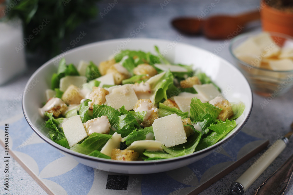 A bowl with classic Caesar salad A bowl with classic Caesar salad
