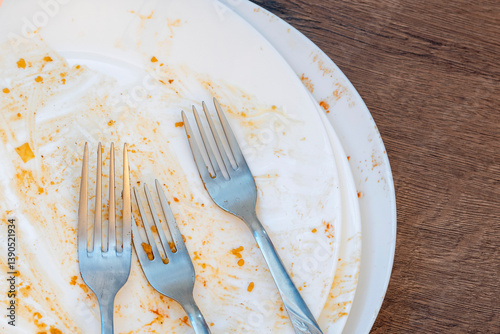 dirty plates after eating. Cutlery. forks on a plate. Dirty dishes after eating. End of meal