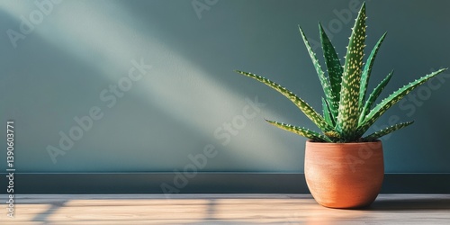 Obraz na płótnie A beautiful green plant in a clay pot. The sunlight highlights its vibrant leaves, adding life to any space. Ideal for interior decor or botanical themes. Perfect for nature lovers. AI w salonie
