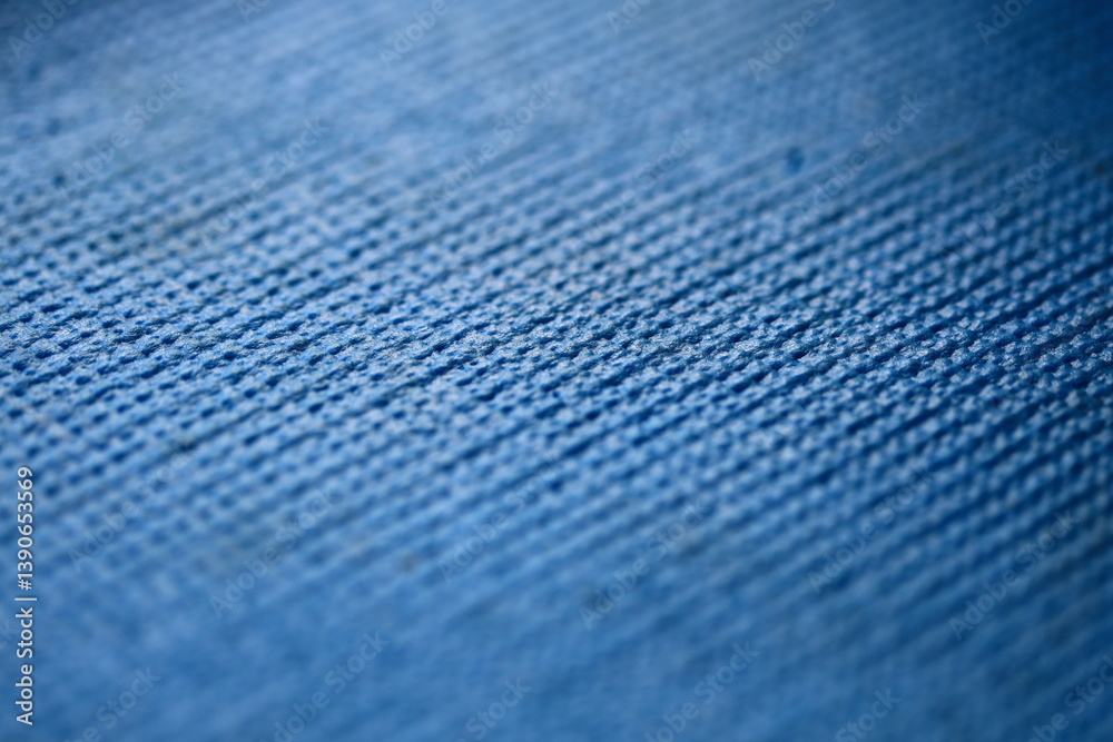 A detailed look at a blue fabric texture.