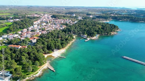 Aerial view of Poreč (Porec), Croatia, showcasing the charming old town, vibrant coastline, and the nearby island of Sveti Nikola. The stunning Zelena Laguna area adds to the beauty turquoise waters
