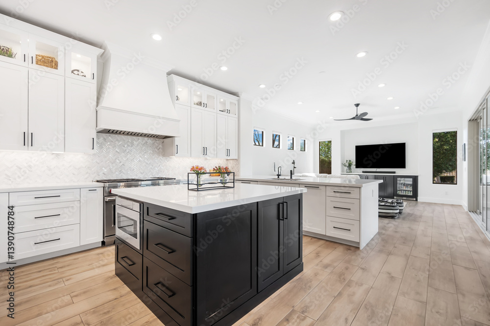 There is a large and spacious island located in the middle of the kitchen area There is a large and spacious island located in the middle of the kitchen area